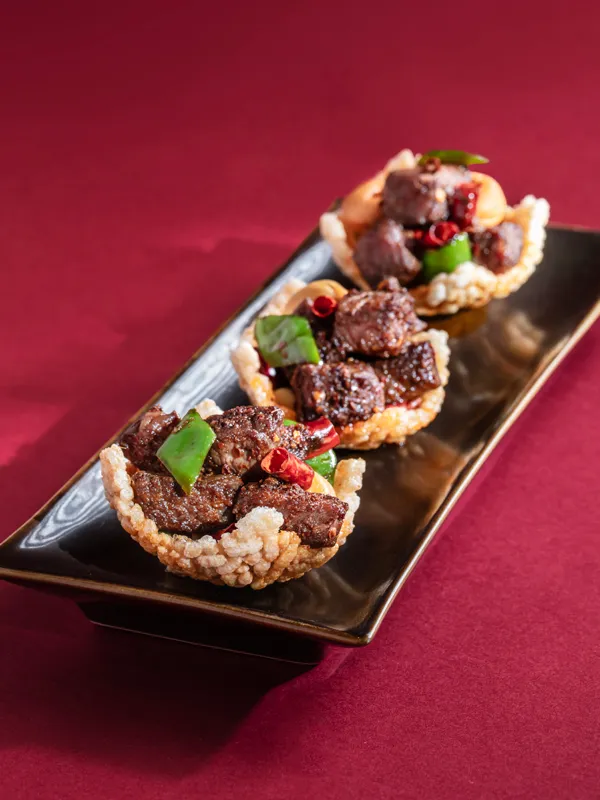 Sautéed Australian Wagyu Beef with Lily Bulbs and Chilli in Crispy Cup